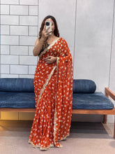 Vibrant Orange Bandhani Georgette Saree with embroidery Lace Border & Running Blouse