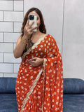 Vibrant Orange Bandhani Georgette Saree with embroidery Lace Border & Running Blouse